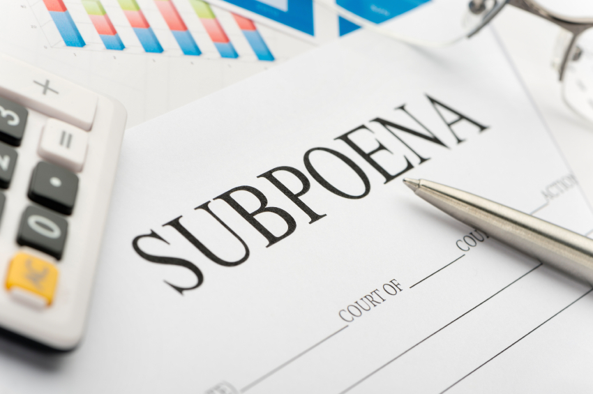 Subpoena form on a desk.